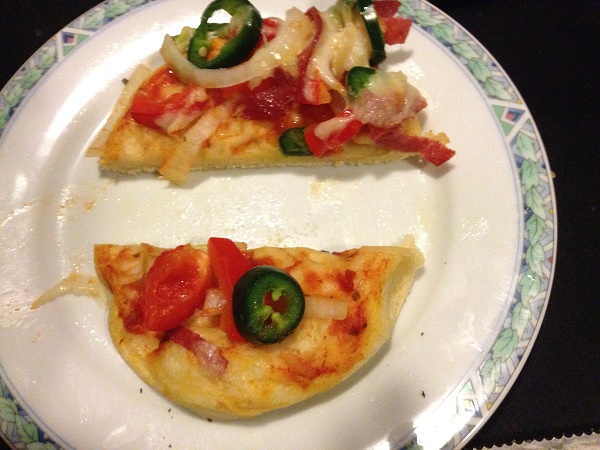 Small pizza with jalapenos paprika and onions